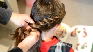 Twisted topsy tail little girl hairstyle