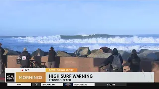Crowds line beach to watch big waves in South Bay