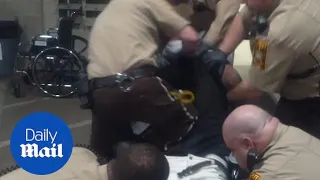 Corrections officer viciously knees and beats suspect