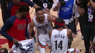 CJ McCollum dancing in front of Brandon Ingram while having a post game interview