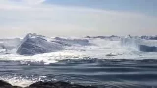 Ilulissat Icefjord - Large iceberg breaking over