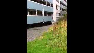 Throwing a bag of water down from a tall building