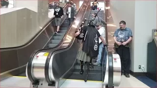 Bagpipe Unicycle Darth Vader vs. Escalator