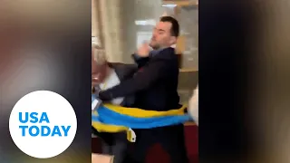 Ukrainian delegate punches Russian official after flag is swiped | USA TODAY