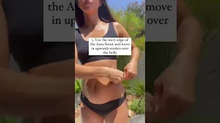 Gua Sha on the BELLY with the Aura SUMMER SMOOTHING Duo