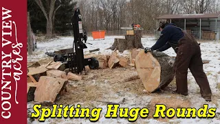 Splitting Huge rounds of wood.  Some are too big to handle.