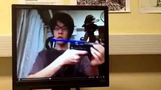 Crazy guy brushing his teeth with a gun