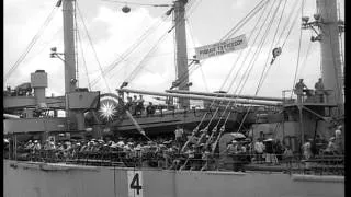 Vietnamese refugees disembark gangway as USS Bayfield arrives in Saigon harbor du...HD Stock Footage