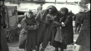 German civilians cross the damaged Tangermunde bridge across the Elbe River in Ge...HD Stock Footage