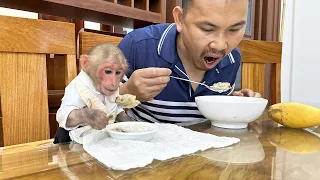 Bibi enjoys the clam porridge he harvested with Dad!