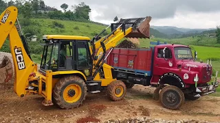 Jcb loading  stone in a truck - jcb loading video
