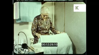 1960s UK, Woman Ironing, Household Chores, 16mm