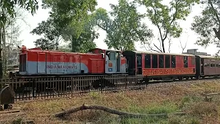Waghai-Bilimora Passenger pulled by ZDM5 Locomotive at Rankuva Level Crossing.