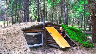 Night in the wild forest in a 2-storey dugout