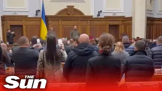 Moment Ukraine Parliament erupts into singing of the national anthem