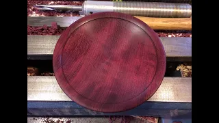 Richard Raffan turns a plate from quilted purpleheart