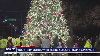 Four volunteers robbed while decorating, Christmas tree goes up in flames