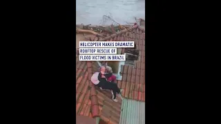 Helicopter makes dramatic rooftop rescue of flood victims in Brazil