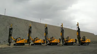 Five newly-delivered JK810 automatic DTH drill rigs working in Xinjiang.