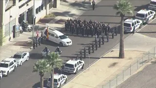 Ofc. Paul Rutherford's body taken to mortuary in solemn procession