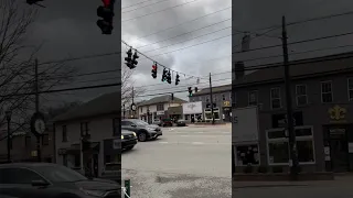 Crazy windstorm in Louisville Kentucky almost ripped a stop light off the wire! Hanging by a thread!