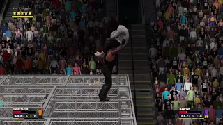 The Undertaker throws Mankind off Hell in a Cell and he plummets 16 feet through an announcers table