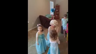 Elsa singing Let it Go at a birthday party.