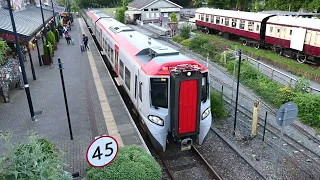 Class 197 arrives and departs Betws-y-Coed station, Wales, for Blaenau Ffestiniog