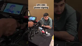 Islam Makhachev, Zubaira Tukhugov and Abubakar Nurmagomedov sign posters for #UFC 280