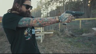 Slade shooting targets with his Agency Arms Sig P320