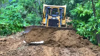 Caterpillar D6R XL bulldozer operator Works very well in widening plantation roads