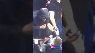 The Lyon fan who threw the watter bottle at Payet, got slapped by the other Lyon fans