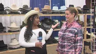 12News Daybreak's Tia Johnson meets a cowboy hat vendor in the exhibit hall at the South Texas State