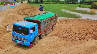 Heavy dump truck moving Rock soil, Strongly Mighty Dozer Pushing Rock soil in to water filling up