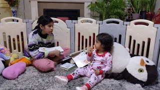 Big sister is trying to entertain small sister by reading books | Sisters Story time