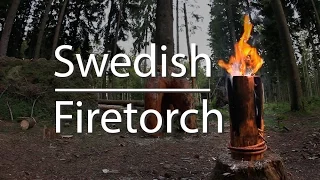 The Swedish Fire Torch (Woodcraft) with hand saw and axe.