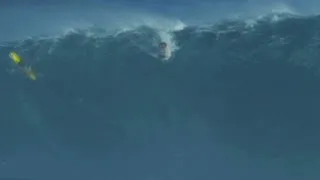 Garrett McNamara catches a record-setting 78-foot wave.