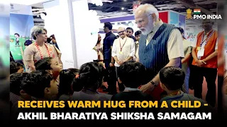 PM Modi receives warm hug from a child 😍 - Akhil Bharatiya Shiksha Samagam
