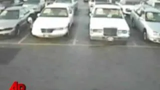 Raw Video: Clumsy Car Burglar Caught on Tape