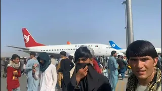 Desperate Afghans crowd Kabul airport apron to flee Taliban | AFP