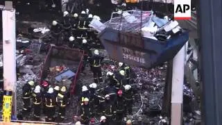 Crowds gathered at scene as efforts to under way to clear rubble after deadly roof collapse