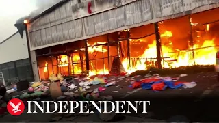 Shopping mall burns after looting in South Africa