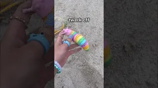 THROWING MY FIDGETS IN THE SAND! 😱🏖️ *rip pop its*