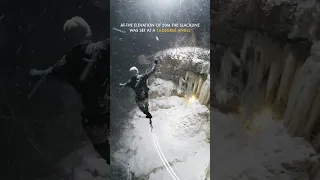 Sliding a slackline with speed 22km/h in socks above frozen waterfall