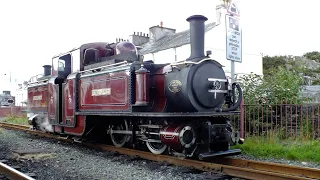 Narrow gauge Double Fairlie steam locomotive , Merddin Emrys , passing over camera at Porthmadog .