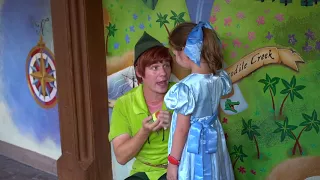 Daisy dressed as Wendy surprises Peter Pan with a Tsum Tsum as a gift.