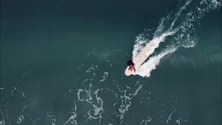 Longboarder Flora surfing Kuta beach Bali 2021 Ninefoot Studio