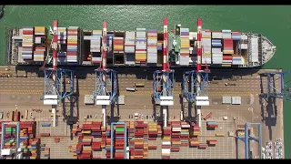 Commercial Port dock with Containers ships unloaded by cranes #stockfootage