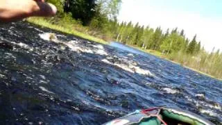 Canoeing down an easy rapid #2 in the Kiiminkijoki river, Finland