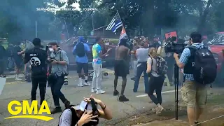 Armed militia groups face off against counter-protesters in Georgia